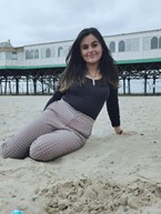 Photo of Nadia Begum on a beach